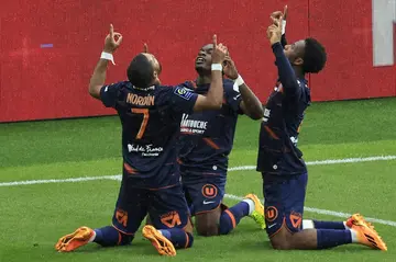 Arnaud Nordin (L) celebrates with teammates during Montpellier's 4-0 win in Monaco on Sunday