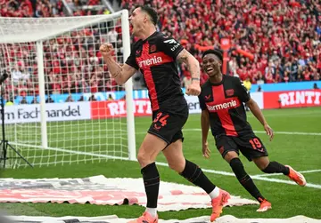 Granit Xhaka (L) scored  Bayer Leverkusen's second goal as they beat Werder Bremen 5-0 to win their maiden Bundesliga title