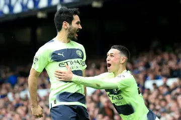 Two good: Ilkay Gundogan (left) scored twice as Manchester City beat Everton