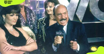 Former professional WWE announcer Gene Okerlund (r) during a WCW broadcast.
