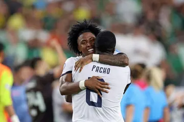 Ecuador defender Angelo Preciado left and team-mate Willian Pacho celebrate their passage to the Copa America quarter-finals