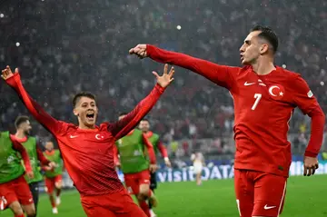 Turkey's Kerem Akturkoglu (R) celebrates scoring his team's third goal in the win over Georgia