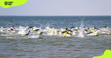 Athletes take part in an aquatic triathlon.