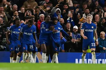 Chelsea players celebrate Noni Madueke's late winner against Crystal Palace from the penalty spot