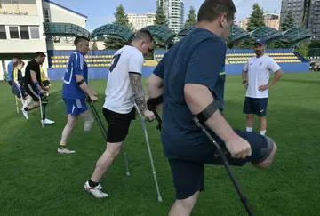 Coach Dmytro Rzhondkovskyi (R) prepares Ukraine's amputee football squad for the Euro 2024 tournament