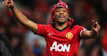 Patrice Evra celebrates victory and winning the Premier League title after the Barclays Premier League match between Manchester United and Aston Villa at Old Trafford on April 22, 2013 in Manchester, England. (Photo by Alex Livesey/Getty Images)