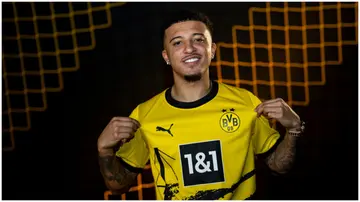 Jadon Sancho poses after being signed by Borussia Dortmund on loan. Photo by Hendrik Deckers.