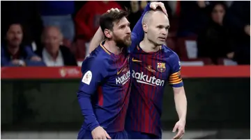 Andres Iniesta celebrates with Lionel Messi after scoring a goal during the Copa del Rey final between Sevilla and Barcelona. Photo by Burak Akbulut.