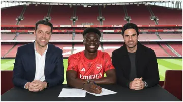 Bukayo Saka with Sporting Director Edu and Mikel Arteta as he signs a new long-term contract at Arsenal. Photo by Stuart MacFarlane.