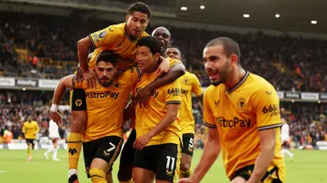 Hwang Hee-Chan of Wolverhampton Wanderers celebrates with teammates after scoring during the Premier League match between Wolves and Manchester City. Photo by Matt McNulty.