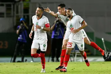Hakim Ziyech (L) celebrates with his Morocco teammates after scoring against Zambia
