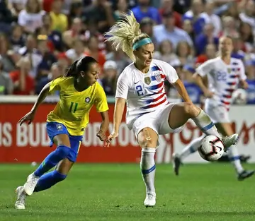 US defender Julie Ertz, at right with the ball against Brazil's Adriana, announced her retirement after helping the Americans win two Women's World Cup titles