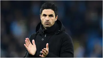 Mikel Arteta applauds the fans after the team's defeat in the Premier League match between Manchester City and Arsenal FC at Etihad Stadium. Photo by Stuart MacFarlane.