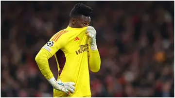 Andre Onana looks dejected during the UEFA Champions League match between Manchester United and FC Bayern München at Old Trafford. Photo by James Gill.