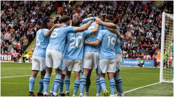 Erling Haaland celebrates with teammates after scoring during the Premier League match between Sheffield United and Manchester City. Photo by Andrew Kearns.