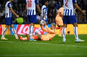 Atletico Madrid striker Antoine Griezmann on the floor during Porto's win over the Spanish side