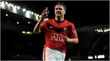 Michael Owen celebrates after scoring during the Barclays Premier League match between Manchester United and West Ham United at Old Trafford in 2010. Photo by Michael Regan.