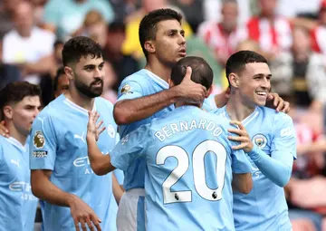 Manchester City midfielder Rodri (C) celebrates his winner at Sheffield United