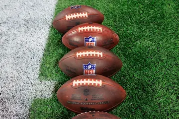 What nickname is stamped on every official NFL football?