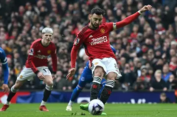 Manchester United midfielder Bruno Fernandes scores from the penalty spot against Everton