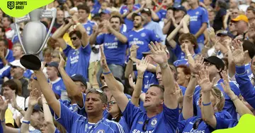 Chelsea FC fans sing during a match.