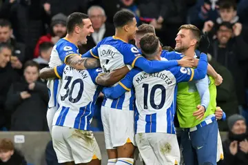 Brighton rock: Solly March celebrates after scoring the opening goal against Liverpool