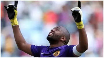 Itumeleng Khune gestures during the Premier Soccer League match between AmaZulu and Kaizer Chiefs. Photo: Steve Haag.