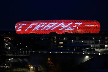 The words 'Danke Franz' ('Thank you, Franz') are projected in tribute to Franz Beckenbauer onto Bayern's Allianz Arena