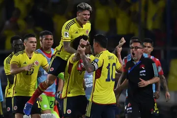 Colombia's Luis Diaz is mobbed by teammates after scoring twice in the 2-1 World Cup qualifying win over Brazil