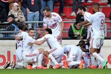 Brest players celebrate after they netted a dramatic injury-time winner against Rennes