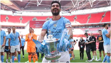 Ilkay Gundogan celebrates with the trophy after the FA Cup final match between Manchester City and Manchester United at Wembley Stadium. Photo by James Gill.