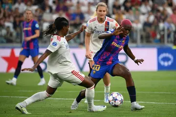 Nigeria star Asisat Oshoala (R) playing for Barcelona against Lyon in the Women's European Champions League final in Turin on May 21, 2022.