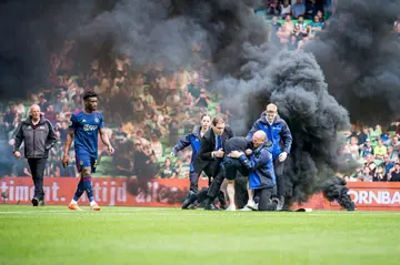'Very sad': A supporter runs on to the pitch during the Dutch league match between FC Groningen and Ajax Amsterdam