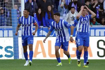 Alaves' Uruguayan midfielder Carlos Benavidez celebrates scoring the opening goal against Atletico