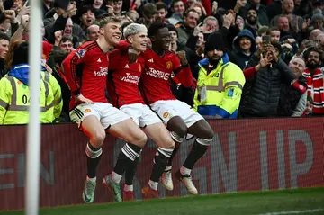 Manchester United's Alejandro Garnacho (C), Rasmus Hojlund (L) and Kobbie Mainoo (R)