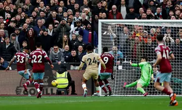 West Ham defender Emerson (L) scores the equalising goal against Chelsea