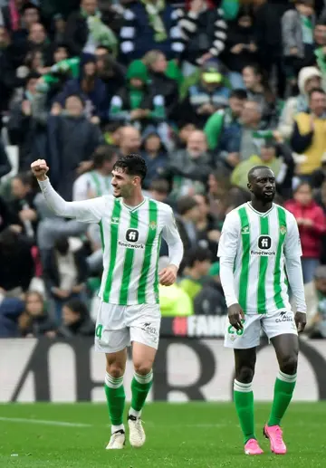 Johnny Cardoso (L) celebrates scoring his team's third goal against Athletic Bilbao on Sunday