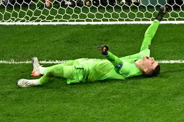 Croatia goalkeeper Dominik Livakovic celebrates his team's shock win over Brazil