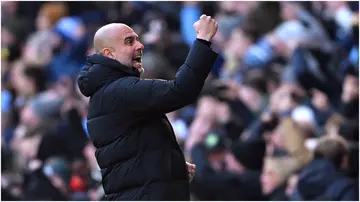 Pep Guardiola celebrates during the Premier League match between Manchester City and Liverpool FC at Etihad Stadium. Photo by Michael Regan.