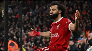 Mohamed Salah celebrates after scoring during the Premier League match between Liverpool FC and Newcastle United at Anfield. Photo by John Powell.