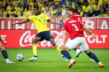 Newcastle have signed Sweden striker Alexander Isak (L)