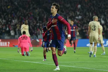 Barcelona's Portuguese forwardJoao Felix celebrates after scoring what proved to be the winner against Porto to send his team through