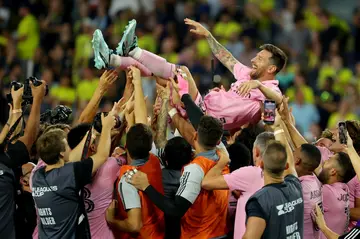 Lionel Messi is hoisted into the air by his Inter Miami teammates after winning the Leagues Cup final in August