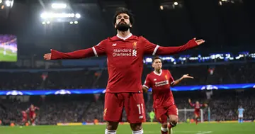 Mohamed Salah celebrates after scoring his side's first goal during the UEFA Champions League Quarter Final Second Leg match between Man City and Liverpool. Photo by Laurence Griffiths.