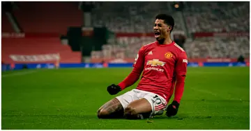 Marcus Rashford celebrates scoring a goal to make the score 1-0 during the Premier League match between Manchester United and Wolves. Photo by Ash Donelon.