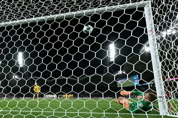 USA's goalkeeper Alyssa Naeher concedes the winning penalty