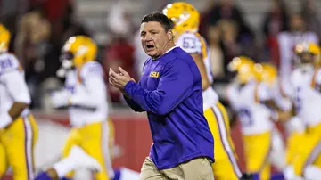 Why did LSU coach Orgeron leave?