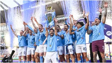 Manchester City captain Ilkay Gundogan lifts the Premier League trophy after the Premier League match between Manchester City and Chelsea FC at Etihad Stadium. Photo by Michael Regan.