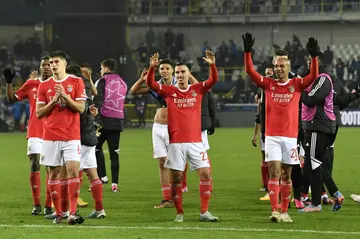 Benfica players celebrate after beating Club Brugge 2-0 in Belgium