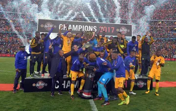 PSL giants, Kaizer Chiefs, celebrating winning the Carling Black Label Cup trophy in 2017.